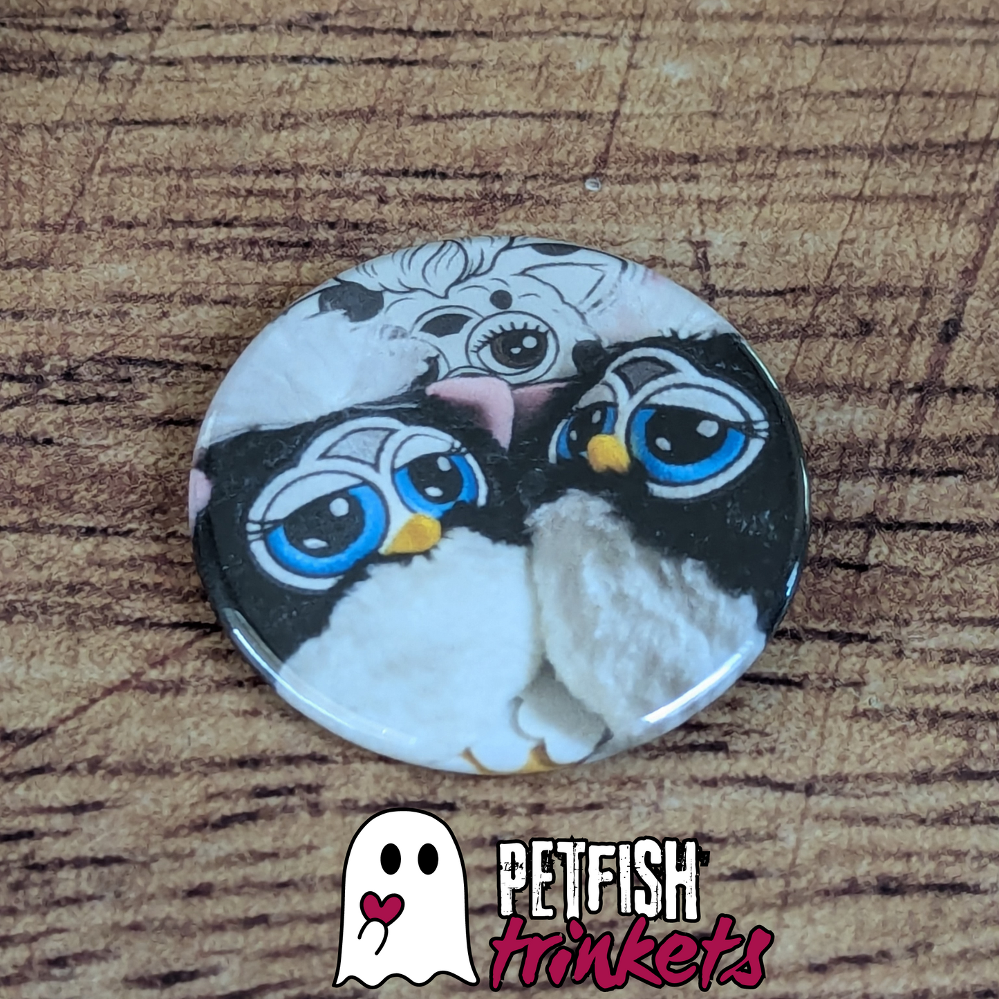 A 1.75in button of two furby