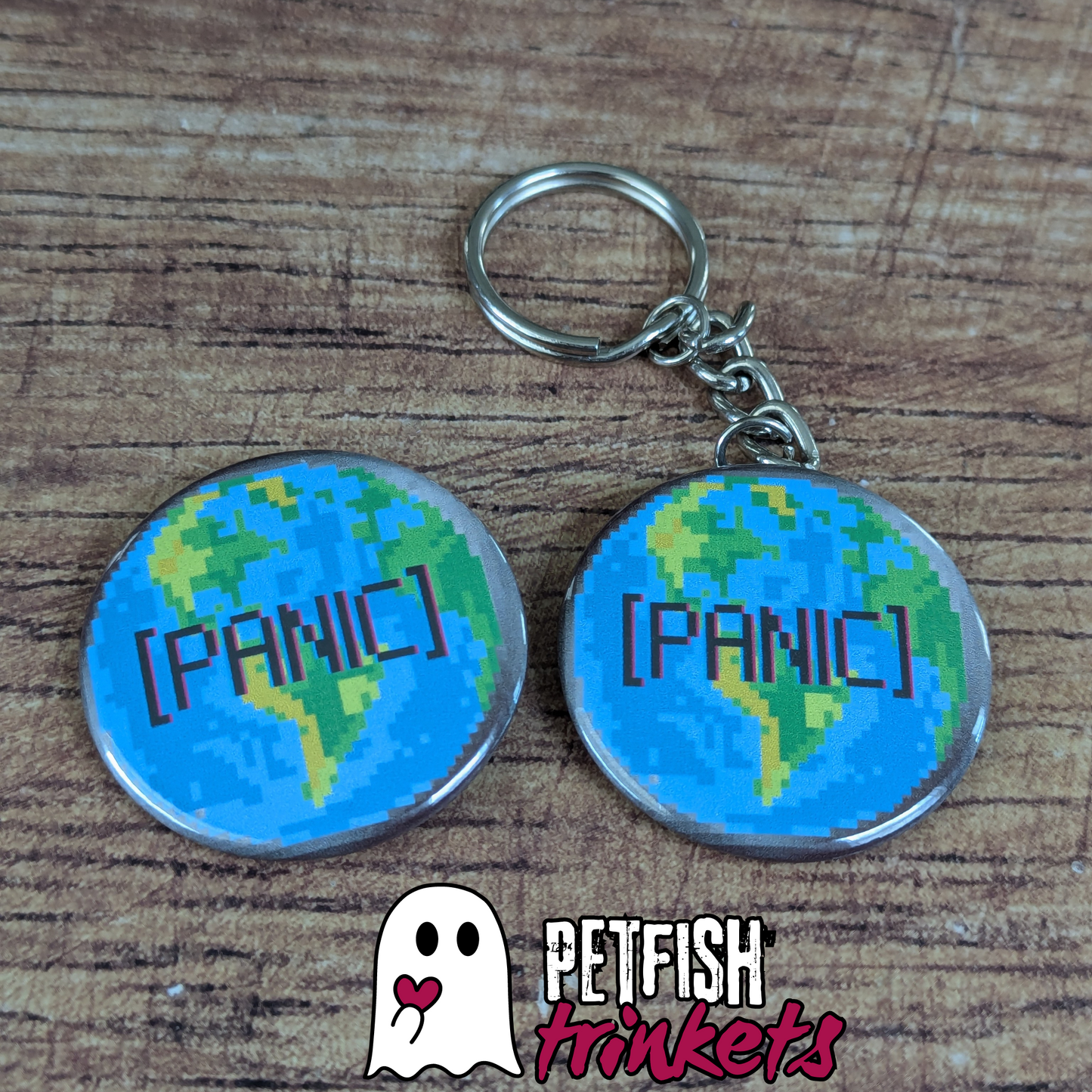 A button and keychain that read panic with the Earth as a background