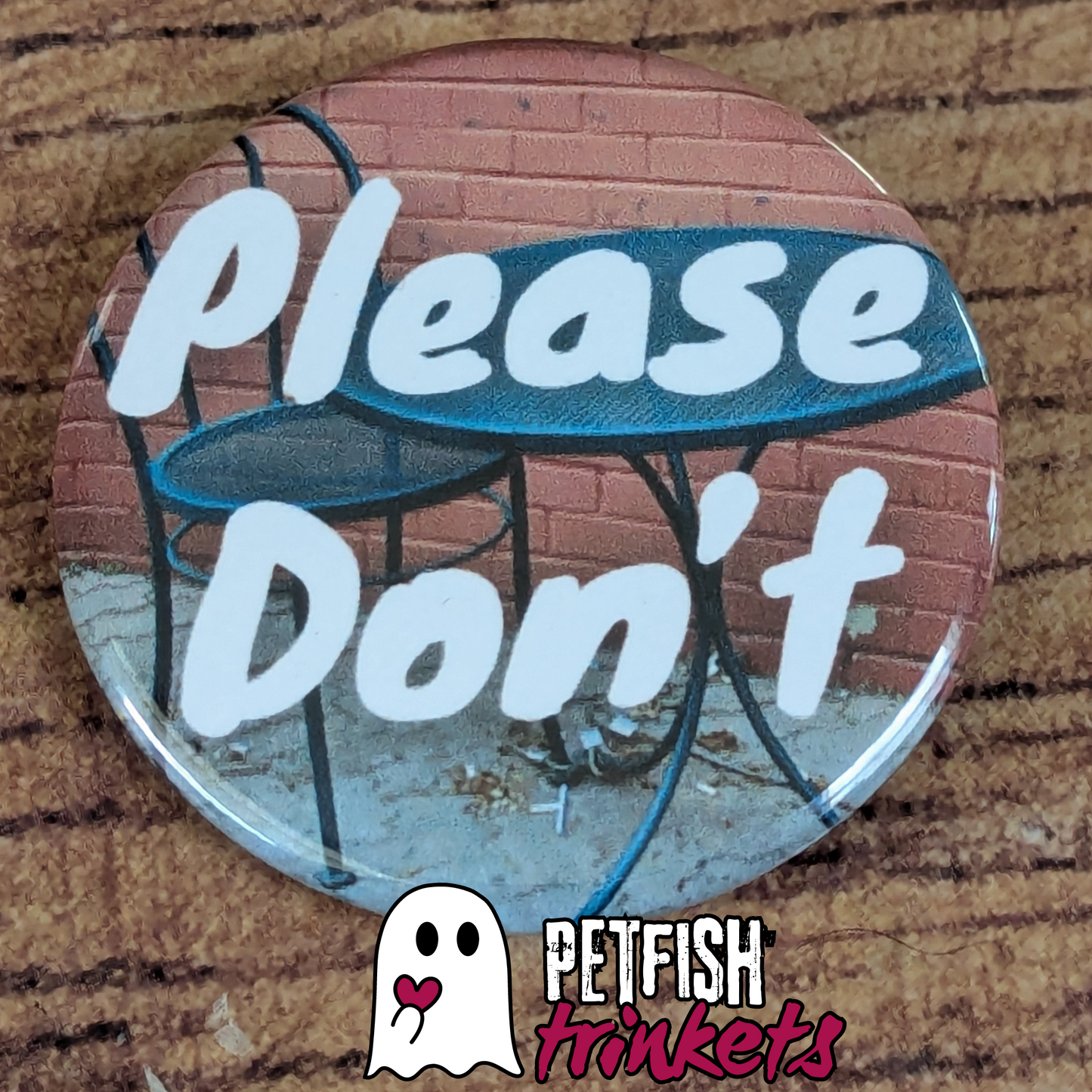 A 1.75 inch button reading Please Don't