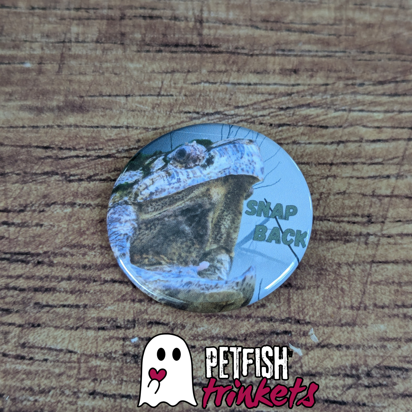 A button with a snapping turtle