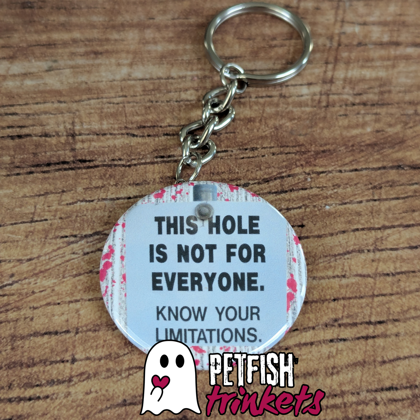 1.75in keychain that reads This Hole is not for everyone. Know your limitations.