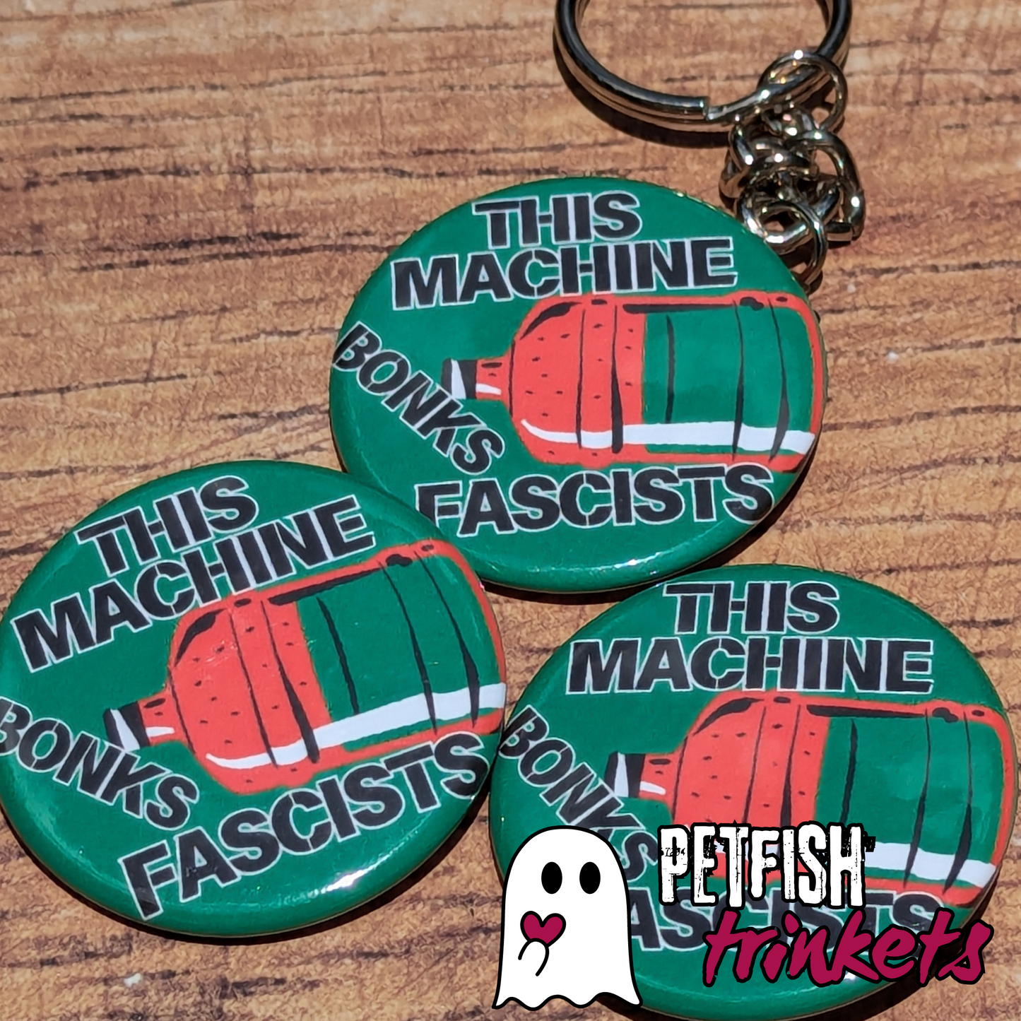 A trio of buttons and a keychain for this machine bonks fascists