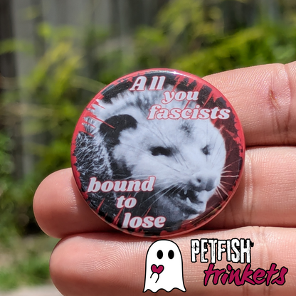 Punk button in hand to give size comparison of 1.75 inches